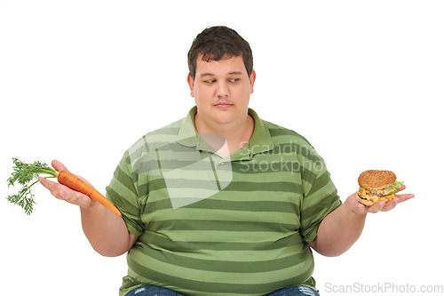 Image of Plus size, diet decision and man with a carrot and fast food choice thinking about balance. Male model, studio and white background with healthy and take away order with weight loss and nutrition