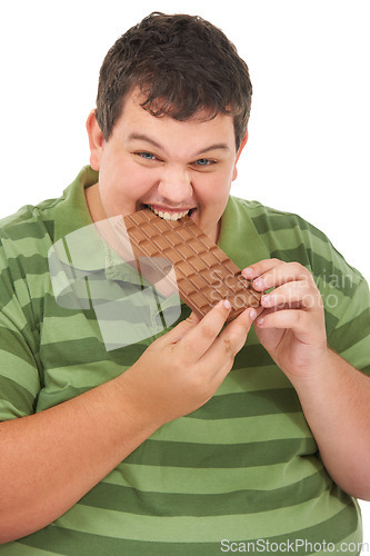 Image of Plus sized, chocolate and portrait of happy man with eating unhealthy diet, smile and isolated on white background. Nutrition, weight loss and food addiction, face of male model with candy in studio.