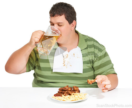 Image of Obesity, man and fast food with alcohol, unhealthy and guy isolated against a white studio background. Obese, male person and model with beer, chicken wings and eating with a bib, fries and hungry