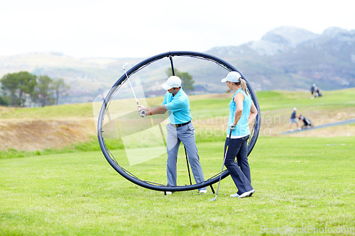 Image of Ring, sports woman or golfer in golf course lesson for fitness, workout or exercise with a swing on field. Coaching, golfing game or athlete training with instructor for driving with a club stroke