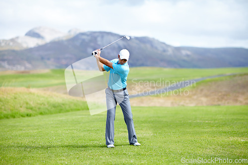 Image of Fitness, man or golfer playing golf for fitness, workout or exercise with a swing on a green course. Wellness, person golfing or athlete training in action or sports game driving with a club stroke