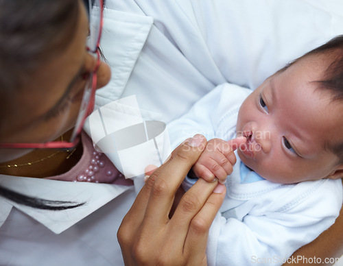 Image of Healthcare, cleft lip and a pediatrician with a baby in the hospital for insurance, care or treatment. Medical, children and a doctor woman holding a newborn with a disability in a health clinic