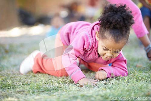 Image of Field, grass and girl with fun, curious and happy in the garden, nature and springtime with joy. Female person, happy toddler or infant in the backyard, outdoor or kindergarden with child development