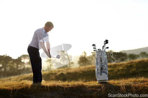 Image of Golf, stroke and man with driver outdoor on course for training, workout or fitness at sunset mockup space. Golfing, club and person swinging for game, competition or exercise, sports and wellness.