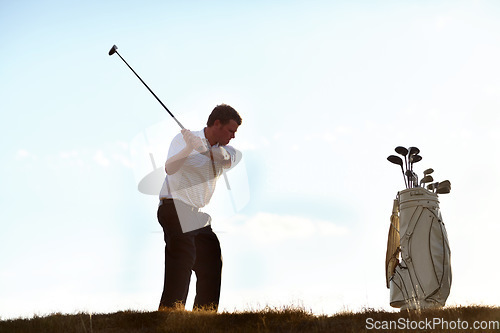 Image of Stroke, golf and man with driver on course outdoor for training, workout or fitness on blue sky mockup space. Golfing, club and person swinging for game, competition or exercise, sports and wellness.