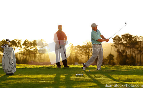 Image of Sunset, golf and men on a course for training, competition or professional game. Fitness, summer and friends on the grass golfing during retirement for holiday, hobby and recreation at a club