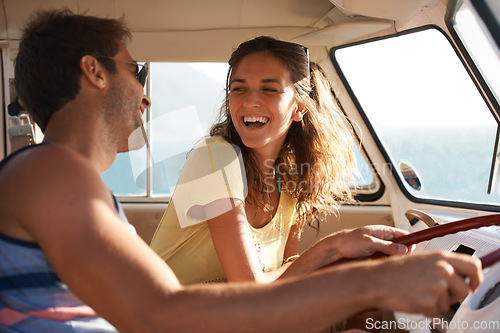 Image of Happy couple, driving and laughing for funny road trip, travel or summer holiday weekend in the car. Man and woman traveling in mini van with laugh and smile for fun discussion or joke on journey