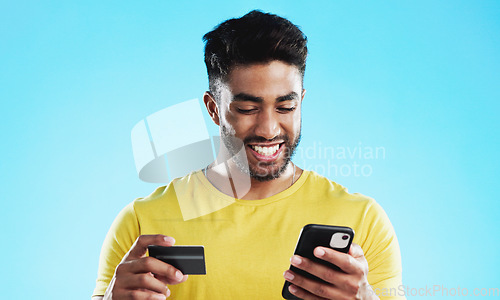 Image of Online shopping, excited or happy man with credit card, phone or digital bank payment for studio fintech sale. Finance app, e commerce banking trade or customer search retail product on store website