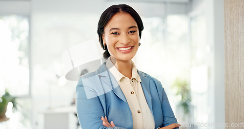 Image of Success, face and business woman in the office with smile, confidence and positive mindset. Happiness, proud and portrait of a professional female employee from Brazil standing in a modern workplace.