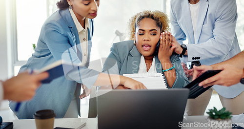 Image of Business woman, laptop and overwhelmed with workload from colleagues multi tasking at office. Female corporate manager working or helping employees in communication with multiple tasks at workplace