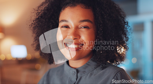 Image of Business woman, portrait and smile at night working overtime at office desk for startup career. Young female entrepreneur leader at company with pride and motivation for positive mindset and face