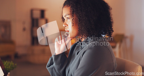 Image of Night, computer and woman thinking, contemplating or ideas for internet review, data analytics or editing report. Serious biracial person brainstorming on desktop PC for online review or job research