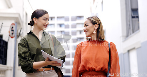 Image of Outdoor, women and employees walking, documents and discussion for ideas, planning and teamwork. Female coworkers, staff and friends with paperwork, smile and communication outside with collaboration