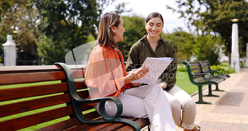 Image of Business, outdoor and women with a notebook, planning or discussion for new project. Female workers, freelancers or employees with paperwork, conversation or brainstorming for proposal or share ideas