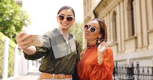 Image of Phone, selfie and friends outdoor taking a profile picture together for social media. Digital, women and girl friend in a home with peace sign posing on a mobile for web app.