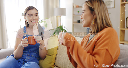 Image of Relax, coffee and friends on a sofa talking, content and bonding on the weekend together. Tea, women and conversation on a couch, smile and chilling in a living room while enjoying comforting drink