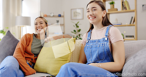 Image of Happy, friends and women on couch, remote and relax with happiness, weekend break and movies. Females, people and girls on sofa, smile and watching television in living room, cheerful and joyful