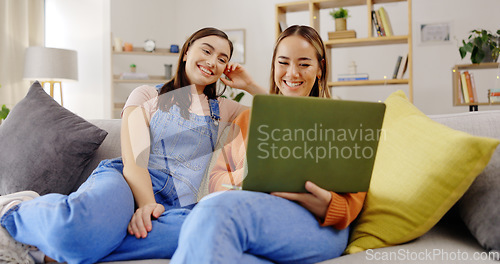 Image of Relax, friends and women with a laptop, sofa and happiness in living room, streaming movies and rest. Female people, joy and girls with technology, happy and search internet on break and laughing