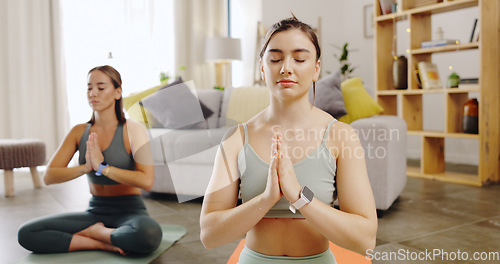 Image of Yoga, friends and women with peace, meditation and fitness for balance, wellness and healthy lifestyle. Female people, happy girls and yogi in living room, chakra and zen for workout, lotus and calm