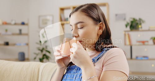 Image of drinking coffee on the sofa for happiness, peace and morning break. Female, latte and person with tea, natural aroma and gratitude with happiness, weekend and calm