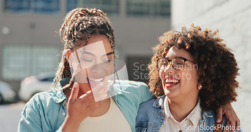 Image of Women, lesbian couple walking and laughing in city, bonding and hugging together on street. Girls, love and smile of happy females talk on romantic date, laugh at funny joke or comedy, humor or comic