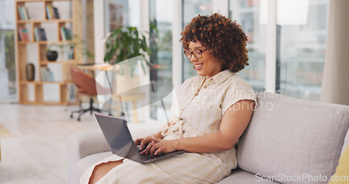 Image of Startup, woman on couch and laptop for remote work from home, connection and typing for data analysis. Female entrepreneur, happy freelancer and consultant in living room, device and website launch