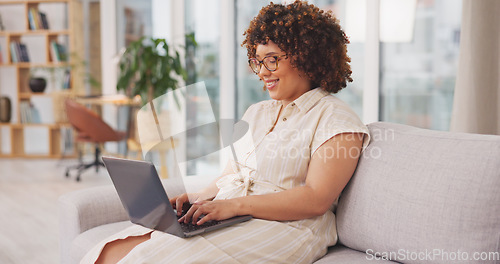 Image of Female entrepreneur, happy freelancer and consultant in living room, device and website launch. Startup, woman on couch and laptop for remote work from home, connection and typing for data analysis.