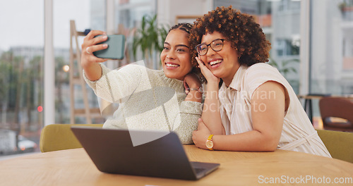 Image of Woman, friends and smile for selfie, vlog or profile picture together blowing kiss by living room table at home. Happy women smiling for photo, memory or facial expression for social media post