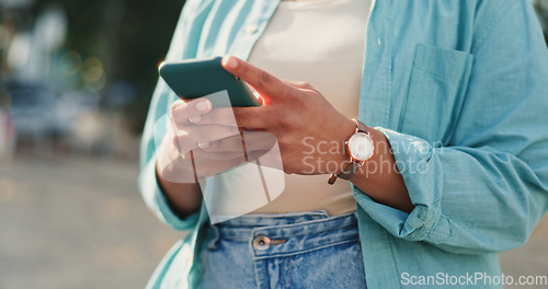 Image of Hand of female chatting on mobile smartphone app for networking with 5G connection in urban town. Woman, hands and phone typing in city for social media post, communication or texting in the outdoors