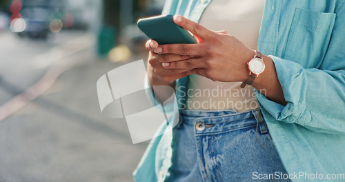 Image of Woman, hands and phone typing in city for social media post, communication or texting in the outdoors. Hand of female chatting on mobile smartphone app for networking with 5G connection in urban town