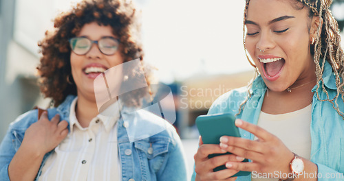 Image of Joke, women and smartphone outdoors, talk and searching, browsing or share social media meme in London. Laughing, phone and friends in a city online for meme, comic or app against an urban background