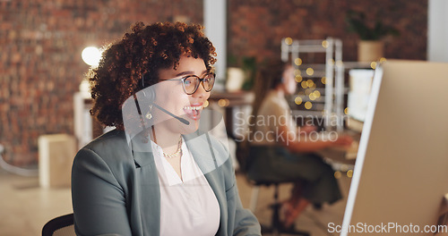 Image of Night call center and happy woman, agent or consultant global discussion, tech support or service at ecommerce startup. Friendly biracial person or business telecom worker virtual talking on computer