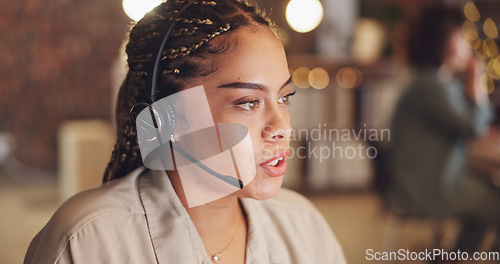 Image of Call Center, focus and a business black woman talking to customer or proposal on her computer while working in the office. Research, productivity with a female employee at work on a project