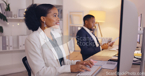 Image of Business people working night, black woman writing report and team, computer and employee at desk with coworking. Overtime, technology and wifi, collaboration and communication with project deadline