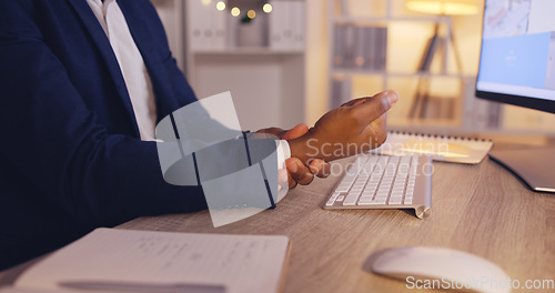 Image of Hands of business man with pain, carpal tunnel syndrome or wrist strain from overtime, late night work or keyboard typing. Arthritis risk, medical emergency and office person with hurt injury problem