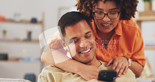 Image of Love, social media and happy couple on sofa with phone, happiness and checking meme in apartment. Smile, man and woman on couch in living room, smartphone and quality time bonding together in home.