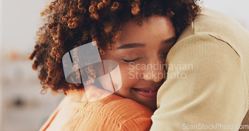 Image of Hug, house and a couple embracing with a smile, comfort and love in the living room. Happiness, care and a man and woman hugging for affection, missing and caring together in the lounge of a home