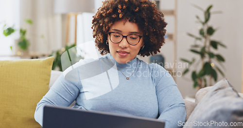 Image of Happy woman, laptop and remote work in home, living room and research online to download media. Female freelancer, computer technology and typing on internet for elearning, website and reading blog