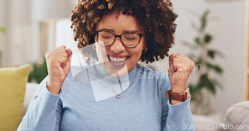 Image of Happy woman with laptop, fist pump and yes to win, winning prize in competition or reward with success at home. Winner, email announcement with celebration, bonus and female cheers for achievement