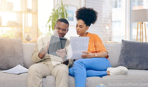 Image of Tablet,documents, smile and couple on sofa in home living room, bonding and online shopping. Interracial, technology and happy black man and woman relax on social media, internet browsing or web scro