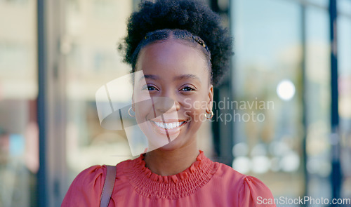 Image of Happy, laughing and face of a black woman in the city for business, commute and work break. Smile, cheerful and the portrait of an African employee with happiness, confidence and funny in town