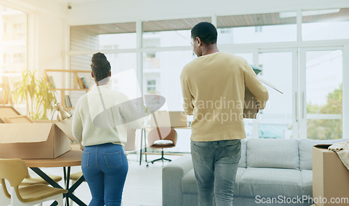 Image of Black couple, hug and smile together in new home with conversation, care and love with bonding. Man, woman and celebration with support, pride or romance with solidarity in house for partnership goal