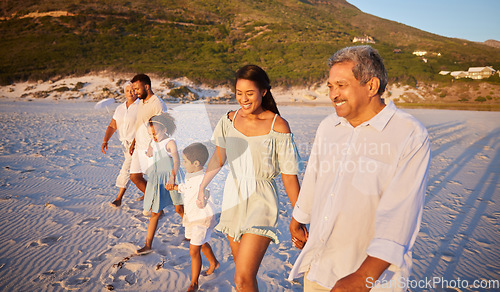 Image of Big family, holding hands or happy kids at sea walking with grandparents on holiday vacation together. Dad, mom or children siblings bonding or smiling with grandmother or grandfather on beach sand
