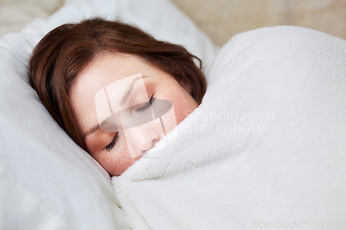 Image of Sleep, rest and woman in bed, peaceful and enjoying a calm nap in her quiet home. Eyes closed, dreaming and female person in a bedroom for snooze, cozy and comfort alone on the weekend in a house
