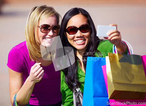 Image of Happy woman, friends and selfie with shopping bag for fashion, social media or purchase outdoors. Women shoppers with smile for photo, memory or picture moment after purchase spree or eccommerce