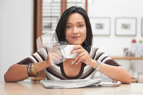 Image of Portrait, drink and woman in coffee shop, restaurant or store, relax and enjoying latte, espresso or caffeine. Face, tea and female person in cafe from Brazil with beverage for calm, peace or break.