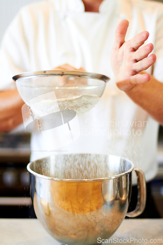 Image of Baker hands, sifting flour and baking skill, cake or pastry with metal bowl closeup, dessert and person in bakery kitchen. Cooking, chef and catering industry tools and production with confectionery