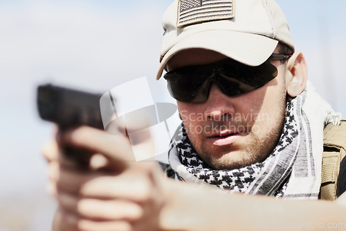 Image of Violence, danger and a man shooting a gun with a target, military training and army service. Serious, risk and a fearless person or shooter with weapon for a violent crime or practice at shoot range