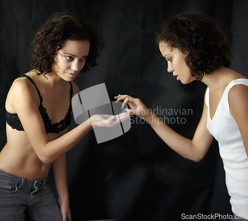 Image of Diet, pills and woman with anorexia in studio for mental health, crisis or problem on black background. Weight loss, medication and obsession by lady with body dysmorphia, bulimia or eating disorder