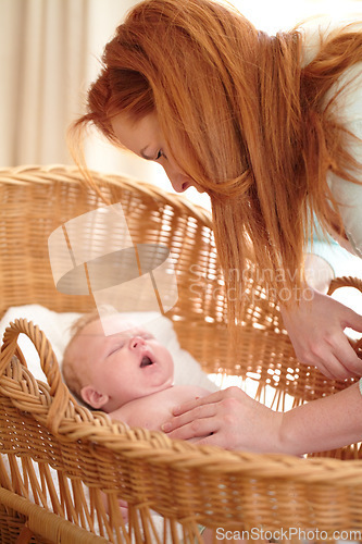 Image of Woman, baby and home bedroom with morning nap, tired yawn and parent love in nursery. Newborn, mother and mama care with young child with sleep in a house with childcare in bed with mom support